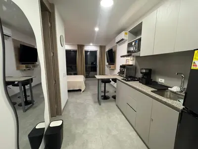 a room with a kitchen and a living room at Apartamento con vista,piscina y playa -SantaMarina-803 in Santa Marta