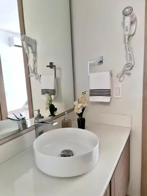 a bathroom with a white sink and a mirror at Morros Eco in Cartagena de Indias