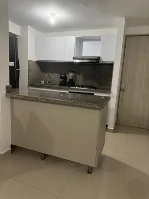 a kitchen with a counter top in a room at Apartamento moderno con una increíble vista en zona exclusiva de la ciudad de Barranquilla in Barranquilla