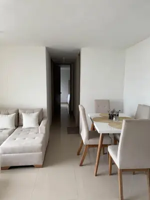 a living room with a couch and a table at Apartamento moderno con una increíble vista en zona exclusiva de la ciudad de Barranquilla in Barranquilla