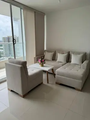a living room with a couch and a coffee table at Apartamento moderno con una increíble vista en zona exclusiva de la ciudad de Barranquilla in Barranquilla