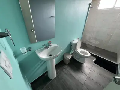 a bathroom with a sink and a toilet at Tarapaca in Barranquilla