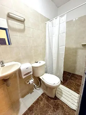 a bathroom with a toilet and a sink at Casa 1811 in Cartagena de Indias