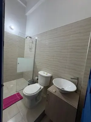a bathroom with a toilet and a sink and a shower at Casa 1811 in Cartagena de Indias