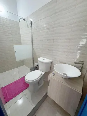 a bathroom with a toilet and a sink at Casa 1811 in Cartagena de Indias