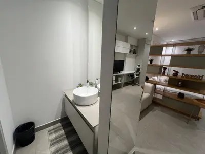 a bathroom with a white sink and a mirror at Distrito 90 in Barranquilla