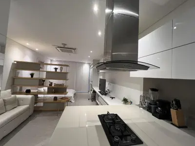 a kitchen with a couch and a stove in a room at Distrito 90 in Barranquilla