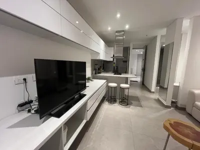 a living room with a large flat screen tv at Distrito 90 in Barranquilla