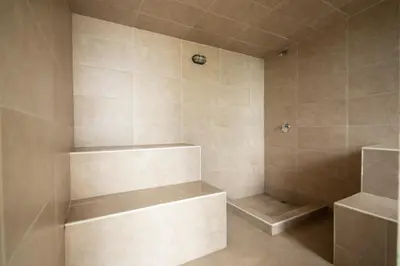 a bathroom with a walk in shower with shelves at Apt 3 Bedrooms SeaView AC Buenavista in Puerto Colombia
