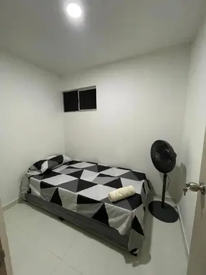 a bedroom with a black and white checkered bed at Apto Amplio con Piscina 3 Hab a Pasos del Mar in Cartagena de Indias