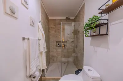 a bathroom with a shower and a toilet at Murano Centro/Nuevo, Moderno/Vista al Mar /Piscina in Cartagena de Indias