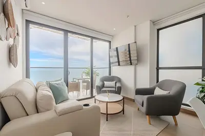a living room with a couch and chairs and a table at Murano Centro/Nuevo, Moderno/Vista al Mar /Piscina in Cartagena de Indias