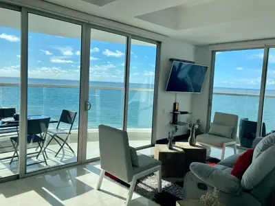 a living room with a view of the ocean at Eliptic Cartagena-Oceano in Cartagena de Indias