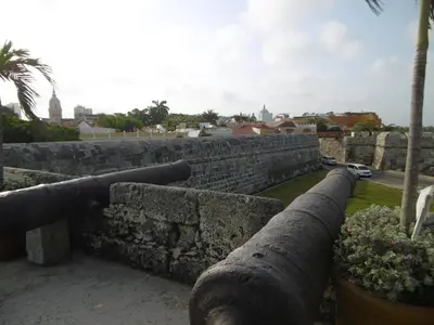 a stone wall with two cannons on top of it at Eliptic Cartagena-Oceano in Cartagena de Indias