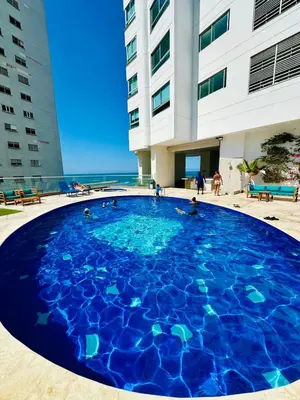a large blue pool in front of a building at Eliptic Cartagena-Oceano in Cartagena de Indias