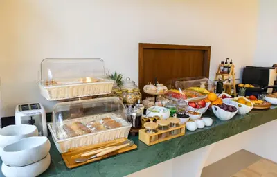 a buffet with many different food items on a counter at Hotel Palacio del Agua by Faranda Boutique in Cartagena de Indias