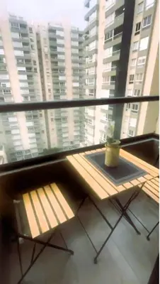 a room with a window with a bench in front of a building at New and Modern Loft in exclusive northern area in Barranquilla