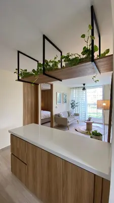 a kitchen with a white counter top in a room at Minimalist and cozy apartment in Barranquilla