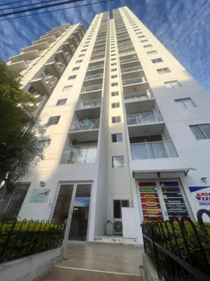 a tall white apartment building with a balcony at Apartamento cerca a playas de marbella in Cartagena de Indias