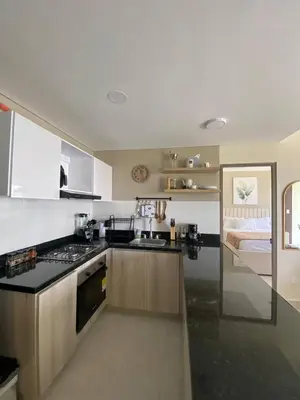 a kitchen with a sink and a stove top oven at Exclusive oasis , Beach, pool and high comfort in Serena del Mar