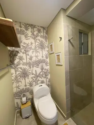 a bathroom with a toilet and a shower at Exclusive oasis , Beach, pool and high comfort in Serena del Mar