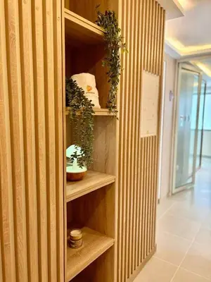 a book shelf with plants on it in a hallway at Exclusive oasis , Beach, pool and high comfort in Serena del Mar