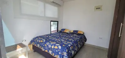 a bedroom with a bed in a white room at Live Stay - Boquilla SunSet in Cartagena de Indias