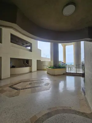 an empty building with a large room with columns and windows at Apartment in El Cabrero in Cartagena de Indias