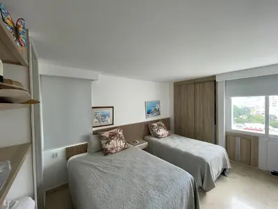 a hotel room with two beds and a window at Oceanfront Oasis in Cartagena de Indias