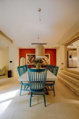 a dining room with a table and chairs at Casa Stella - Authentic Luxury Rooftop Pool in Cartagena de Indias