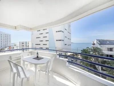 a balcony with a table and chairs and the ocean at Tropical Beach - Con vista al mar in Cartagena de Indias