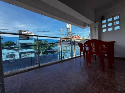 a room with a table and chairs and a large window at Mar azul Cartagena in Arizona