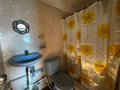 a bathroom with a blue sink and a toilet at Mar azul Cartagena in Arizona