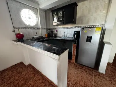 a kitchen with a sink and a refrigerator at Mar azul Cartagena in Arizona