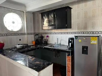a kitchen with a sink and a refrigerator at Mar azul Cartagena in Arizona
