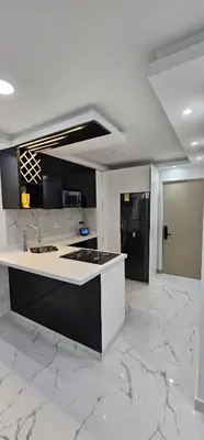 a white kitchen with a counter and a sink at Acuarium in Cartagena de Indias