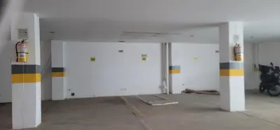 a garage with white walls and yellow and black stripes at Live Stay - Boquilla Le Solei in Cartagena de Indias