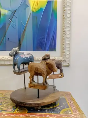a wooden stand with figurines of animals on it at Luxury Duplex Retreat, Aldaba Selection in Cartagena de Indias