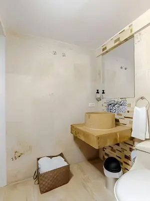 a bathroom with a sink and a mirror at Luxury Duplex Retreat, Aldaba Selection in Cartagena de Indias