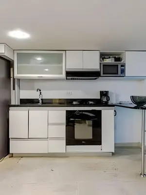 a kitchen with white cabinets and a sink at Luxury Duplex Retreat, Aldaba Selection in Cartagena de Indias