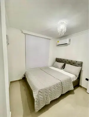 a bedroom with a large bed in a room at Apartment in Barranquilla in Barranquilla