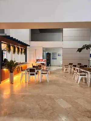 a restaurant with tables and chairs in a room at Apartment in Cartagena 5 minutes from the historic center in Cartagena de Indias