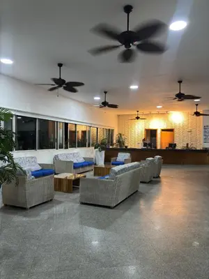 a living room with couches and ceiling fans at Apartment in Cartagena 5 minutes from the historic center in Cartagena de Indias