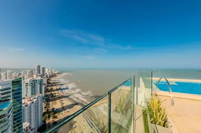 a view of the beach from the balcony of a building at Premium con ubicación excelente en Bocagrande in Cartagena de Indias