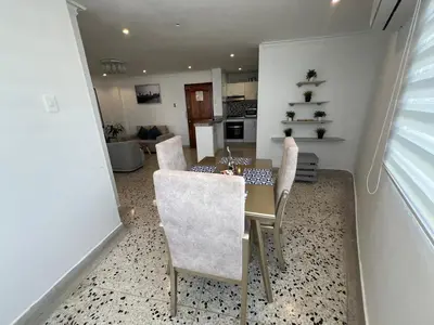 a dining room with a table and chairs at Luz in Barranquilla