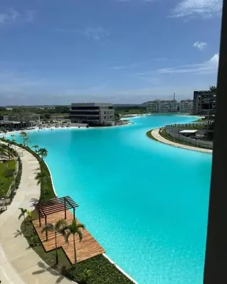 a large pool of blue water in a city at 2BR 2BA Apt Baia Kristal Cartagena Crystal Lagoon in Cartagena de Indias