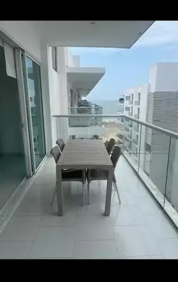 a table and chairs on the balcony of a building at Modern and comfortable in Cartagena de Indias