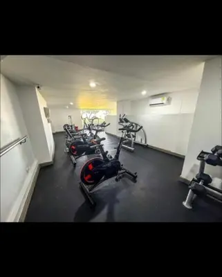 a gym with several exercise bikes in a room at Modern and comfortable in Cartagena de Indias