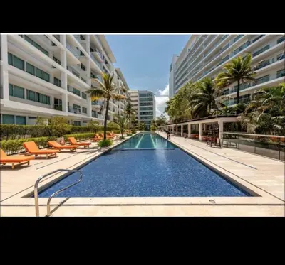 a large swimming pool in the middle of a building at Modern and comfortable in Cartagena de Indias