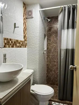 a bathroom with a sink and a toilet and a shower at Moderno Rincón Urbano in Cartagena de Indias